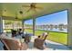 Relaxing screened porch overlooking a lake at 113 Pecorri Ct, Auburndale, FL 33823