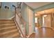 Inviting entryway with staircase and tile flooring leading to the front door at 113 Pecorri Ct, Auburndale, FL 33823