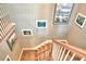 Elegant staircase with wood railings and wall art at 113 Pecorri Ct, Auburndale, FL 33823