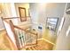 Elegant staircase with wood railings and wall art at 113 Pecorri Ct, Auburndale, FL 33823