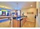 Home bar with granite countertop and mini-fridge at 113 Pecorri Ct, Auburndale, FL 33823