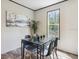 Bright dining area with glass table and four modern chairs at 11466 Nw 8Th Pl, Ocala, FL 34482