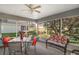 Relaxing screened porch with seating and outdoor dining area at 11579 Se 172Nd Loop, Summerfield, FL 34491