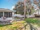 Outdoor living space featuring screened in porch, patio and fire pit at 11744 Oswalt Rd, Clermont, FL 34711