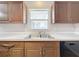 Kitchen sink and window showcasing a clean and functional space with ample counter space at 11744 Oswalt Rd, Clermont, FL 34711