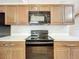 Close-up of kitchen appliances and cabinetry, highlighting the modern design and functionality at 11744 Oswalt Rd, Clermont, FL 34711