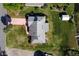 Aerial shot of the property showcasing the roof, the garden and big backyard at 1320 Cove Pl, Tavares, FL 32778