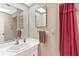 Bathroom with vanity sink and cabinet and a mirror at 1320 Cove Pl, Tavares, FL 32778