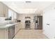 Well-lit kitchen with stainless steel appliances, ample cabinet space, and a functional layout at 1320 Cove Pl, Tavares, FL 32778