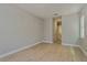 Bright bedroom with hardwood floors and access to a bathroom at 14261 Crest Palm Ave, Windermere, FL 34786