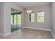 Dining room with sliding glass doors leading to a patio at 14261 Crest Palm Ave, Windermere, FL 34786