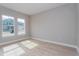 Bright living room with hardwood floors and large windows at 14261 Crest Palm Ave, Windermere, FL 34786