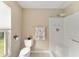 Updated bathroom with a shower/tub combo and toilet at 1514 Vandam St, The Villages, FL 32162