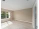 Bright bedroom with light wood flooring and large window at 1514 Vandam St, The Villages, FL 32162