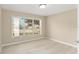 Bedroom with large window and light flooring at 1514 Vandam St, The Villages, FL 32162