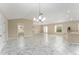 Open concept living space with tile floors and high ceilings at 1514 Vandam St, The Villages, FL 32162