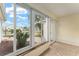 Bright sunroom with tiled floor and view of the yard at 1514 Vandam St, The Villages, FL 32162