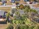 Aerial view of home with pool and lush landscaping at 15729 Greater Groves Blvd, Clermont, FL 34714