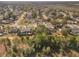 Wide aerial view of home and surrounding neighborhood at 15729 Greater Groves Blvd, Clermont, FL 34714