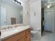 Bathroom with single sink, toilet and shower at 15729 Greater Groves Blvd, Clermont, FL 34714