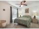 Spacious bedroom with a large window and ceiling fan at 15729 Greater Groves Blvd, Clermont, FL 34714