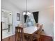 Dining room with light wood table and chairs, near kitchen at 15729 Greater Groves Blvd, Clermont, FL 34714