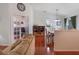 Open dining area with hardwood floors and adjacent kitchen at 15729 Greater Groves Blvd, Clermont, FL 34714