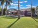 Backyard view of home with a large screened patio at 15729 Greater Groves Blvd, Clermont, FL 34714