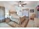 Spacious main bedroom with a ceiling fan and large windows at 15729 Greater Groves Blvd, Clermont, FL 34714