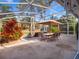 Enjoy dining al fresco in this large screened patio area at 15729 Greater Groves Blvd, Clermont, FL 34714