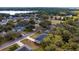 Beautiful aerial view of a quiet neighborhood with mature trees and lush landscaping near a serene lake at 1617 Myrtle Lake Ave, Fruitland Park, FL 34731