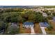 Aerial view of a two-story home with red outline of property, long driveway, and green landscaping at 1617 Myrtle Lake Ave, Fruitland Park, FL 34731