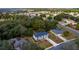 Birds eye view of a neighborhood, featuring well-maintained properties, mature trees, and scenic views at 1617 Myrtle Lake Ave, Fruitland Park, FL 34731