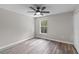 Well-lit bedroom with ceiling fan and closet at 1617 Myrtle Lake Ave, Fruitland Park, FL 34731