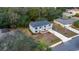 Aerial view of a two-story home with new roof, long driveway, and green landscaping at 1617 Myrtle Lake Ave, Fruitland Park, FL 34731