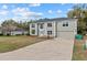 Spacious two-story home with manicured lawn and three-car garage at 1617 Myrtle Lake Ave, Fruitland Park, FL 34731