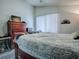 Bedroom with wooden sleigh bed, dresser and access to exterior at 1668 Cr 543A, Sumterville, FL 33585