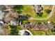 Stunning aerial view of the property showcasing lush greenery, lake access, and neighborhood at 1702 N County Road 452, Eustis, FL 32726