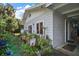 Exterior view with a landscaped walkway leading to the side door at 1702 N County Road 452, Eustis, FL 32726