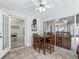 Breakfast nook inside sunroom with a view of a large living area at 17180 Se 115Th Terrace Rd, Summerfield, FL 34491