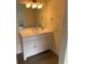 Clean bathroom with vanity, mirror and modern fixtures at 17202 Sandalwood Dr # 202, Wildwood, FL 34785