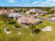 Overhead shot of single story home featuring large yard, landscaping, lanai, and street view at 17457 Se 121St Cir, Summerfield, FL 34491