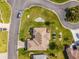 Overhead view of home showcasing manicured landscaping, roof, and surrounding streetscape at 17457 Se 121St Cir, Summerfield, FL 34491