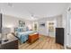 A bright main bedroom with wood floors, ceiling fan, and lots of natural light at 17457 Se 121St Cir, Summerfield, FL 34491