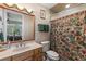 Bathroom featuring a shower, decorative shower curtain, and a wooden vanity at 1825 Myrtle Lake Ave, Fruitland Park, FL 34731