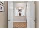 Inviting hallway with decorative tiled floors and niche featuring art and decorative items at 1825 Myrtle Lake Ave, Fruitland Park, FL 34731