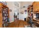 Functional home office with hardwood flooring, custom shelving, and ample space for a comfortable workspace at 1825 Myrtle Lake Ave, Fruitland Park, FL 34731