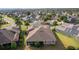 Aerial view of home and neighborhood featuring manicured lawns and mature trees at 2017 Royal Elm Rd, The Villages, FL 32162