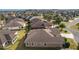 Spacious single-Gathering home in a well-maintained neighborhood with lush landscaping and mature palm trees at 2017 Royal Elm Rd, The Villages, FL 32162