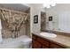 Bathroom with a tub and shower, toilet, single vanity and mirror at 2017 Royal Elm Rd, The Villages, FL 32162